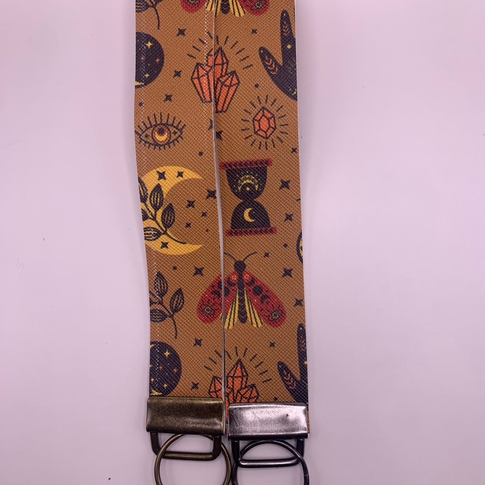 Mystical Patterned Wristlet with Gold and Silver Buckles